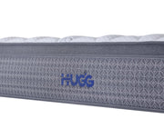 Gray mattress with 'Hugg' branding on a white background